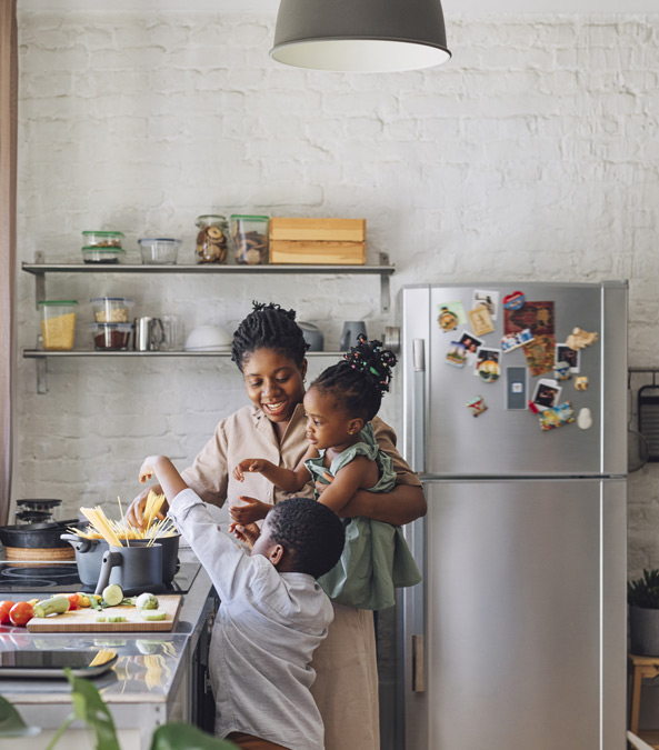 Family cooking in kitchen
